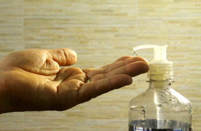 Closeup of hand using hand sanitizer